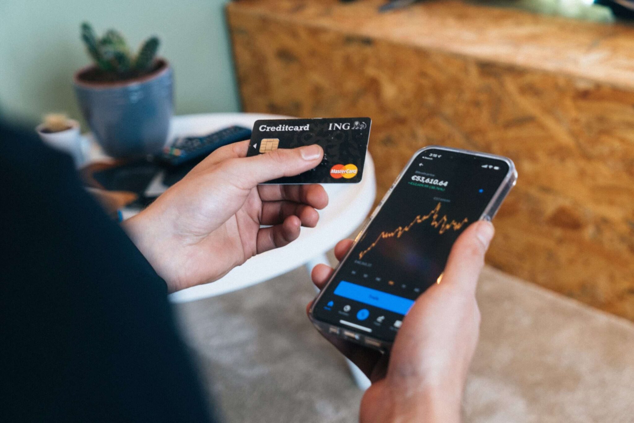 A credit card and phone with training indices to represent Mastercard's acknowledgement of the potential value of Blockchain