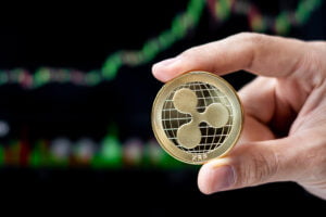 XRP coin indicating recent surge in XRP AUM, posing a $1 Price rally.